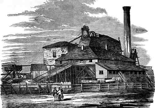 Engraving of a fenced building with tall power plant chimney and hit head machinery showing above roof