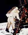 Thumbnail of Buzz Adrin on moon in space suit, stepping at bottom of ladder of the the lunar module