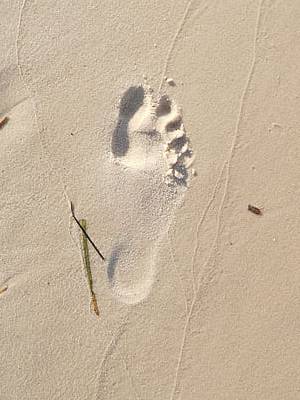 Photo of a bare-foot print on sand