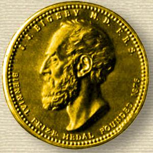 Photo of the obverse of Bigsby Medal, struck in gold, relief of John Bigsby, face, facing left.