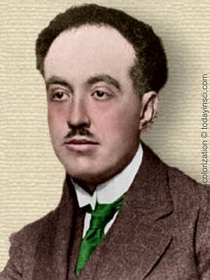 Photo of Louis de Broglie, head and shoulders facing left. Colorization © todayinsci.com