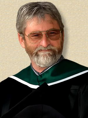 Photo of Richard Cowen, upper body, facing forward, wearing academic gown