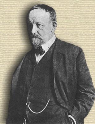 Photo of Max Delbruck (1850-1919), upper body, facing left, hands in pockets