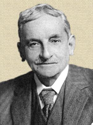 Photo of Sir Arthur Evans, b/w, head and shoulders, facing forward