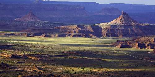 Photo Utah's Bears Eyes Natl Monument, twin buttes on skyline of desert mesa, deep sandstone canyons, forested highlands
