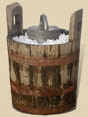 Vertical cylindrical metal container with handled lid almost covered with crushed ice in an outer wooden bucket