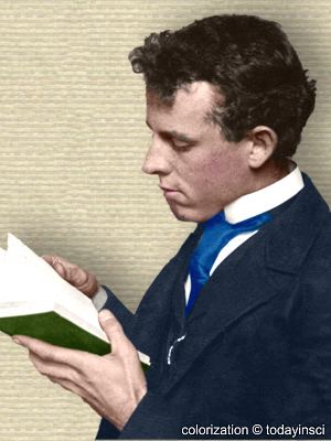 Photo of David Fairchild, upper body, facing left reading book. Colorization © todayinsci.com