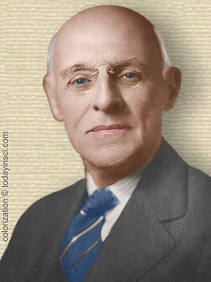 Photo of Abraham Flexner, head and shoulders facing front. Colorization © todayinsci.com