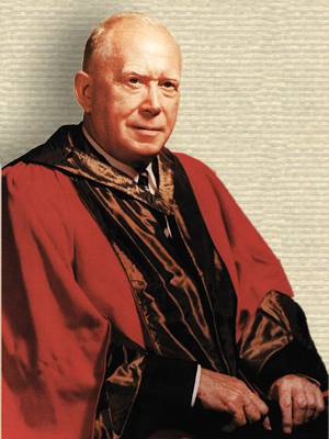 Portrait photo R.E. Gibson in red academic robes, seated, upper body facing right