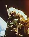 Thumbnail of Richard Gordon on extravehicular activity in space working on the tethered Agena target space vehicle.
