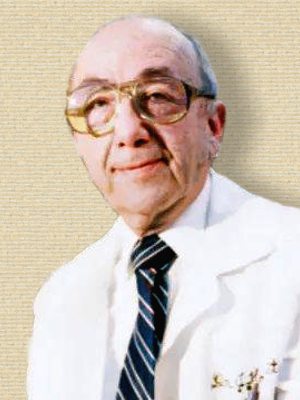 Photo of Jerome Horwitz, lab coat, head&shoulders, facing front. Colorized with help of palette.fm