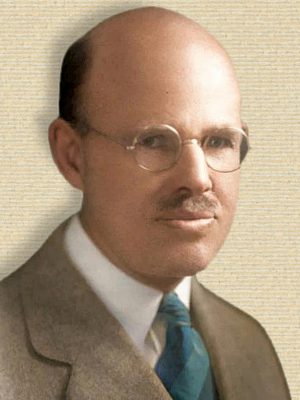 Photo of Ellsworth Huntington, head and shoulders, facing half-right, colorized from original b/w with help by palette.fm