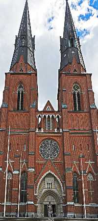 Upsala Cathedral, front elevation, entrance, rose window, twin steeples, intricate stonework, carved figures, clock face