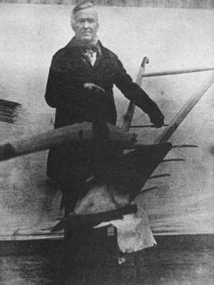 Stephen McCormick showing his plow - full-length photo