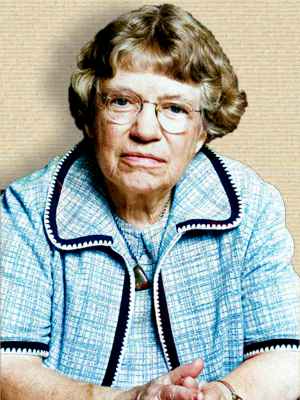 Colorized photo of Margaret Mead, 1977, upper body facing front, hands on table. Credit palette.fm for colorization assistance