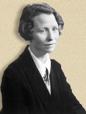 Studio photo of Edna St Vincent Millay, seated, head & shoulders, body turned half-right, facing right, b/w