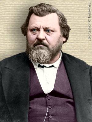 Portrait photo of Carl Vogt, upper body, facing forward, colorization © todayinsci