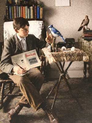 Alexander Wetmore as teen at home, seated note-taking, bluejay specimen on side table. Orig b/w colorized w/A.I. ChatGTP(260407)