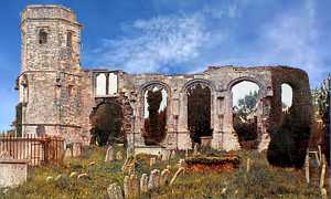 Postcard image of Holy Ghost Church ruins, tower, no roof, remains of wall with empty window arches, gravestones in foreground